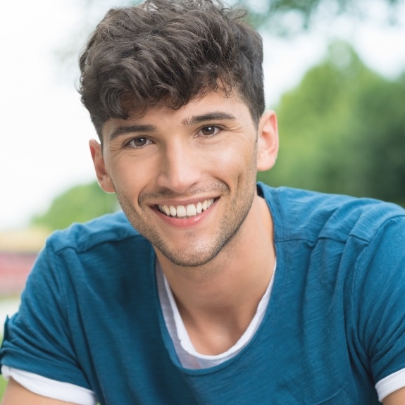 Smiling young man in blue T shirt