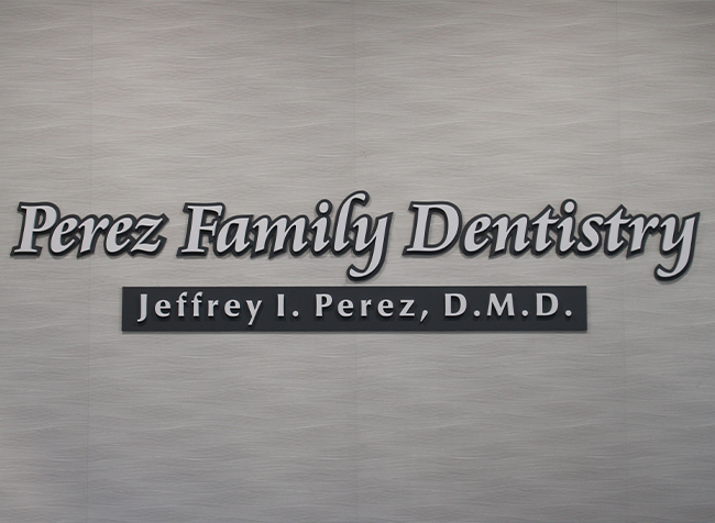 Perez Family Dentistry sign on wall of Marco Island dental office